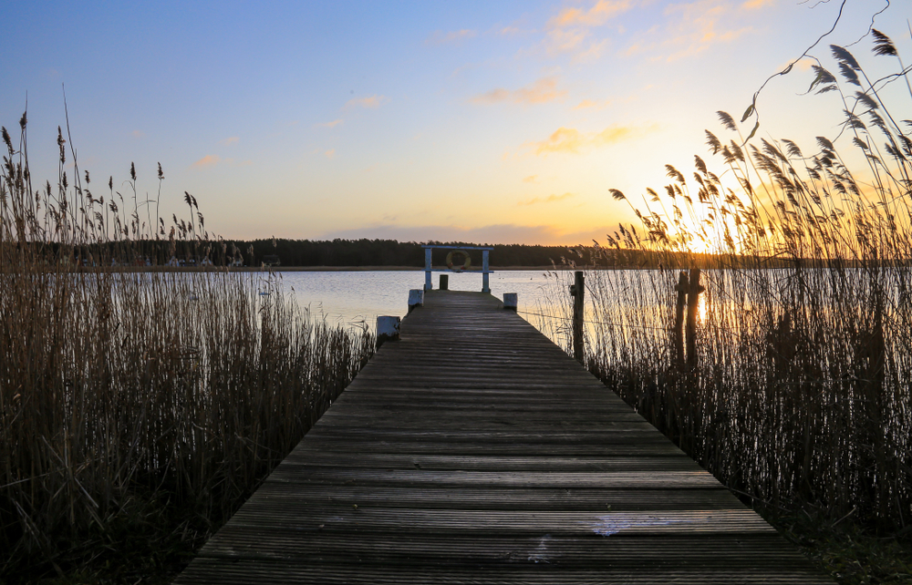 Old,Wooden,Pier,At,Small,Beautiful,Pond,On,Sunset